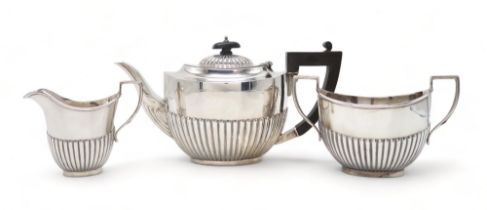 A GEORGE V THREE PIECE SILVER TEA SERVICE by Martin Hall & Co, Birmingham 19198, in the Queen Anne