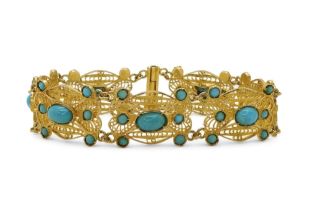 A FILIGREE AND TURQUOISE BRACELET made in bright yellow metal stamped with Arabic marks verso and