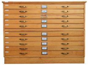 A 20TH CENTURY PITCH PINE PLAN CHEST with laminate top over ten narrow folio drawers on plinth base,