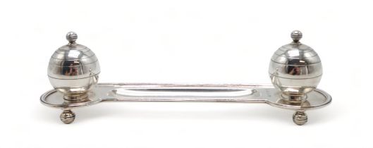 AN ART DECO SILVER INKSTAND by Adie Brothers, Birmingham 1937, of oblong form, with two stylised