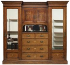 A VICTORIAN ROSEWOOD AND SATINWOOD VENEERED COMPACTUM WARDROBE  with moulded inverted breakfront