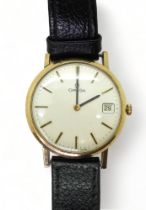 A 9CT GOLD GENTS OMEGA WATCH with silvered dial, gold and black baton numerals and hands, with