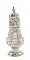 A GEORGE II SILVER CASTER London 1733, maker's mark C? with a mullet below, of baluster form,