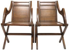 A PAIR OF VICTORIAN OAK GLASTONBURY CHAIRS  plain unadorned backs flanked by shaped arms carved with