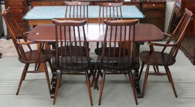 A mid 20th century Ercol stained elm and beech Ercol dining table and six chairs, table with