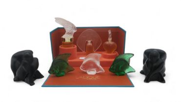 A small collection of Lalique glass figures including two black nudes sitting with legs crossed, two