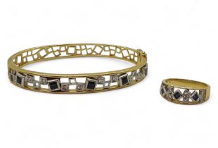 An 18ct gold sapphire and diamond bangle, with a matching ring, bangle set with estimated approx 0.
