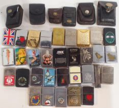 A collection of cigarette lighters, comprising silver-plated examples by Dupont and Dunhill, the