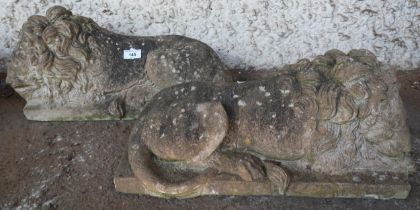 A pair of 20th century stoneware garden statues of sleeping lions, 21cm high x 49cm long x 20cm deep