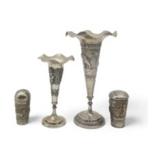Two Persian white metal trumpet vases, with shaped rims, with two similar walking cane ferrules (