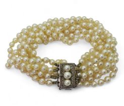 A four strand cultured pearl necklace, with a silver and pearl clasp, length of shortest length