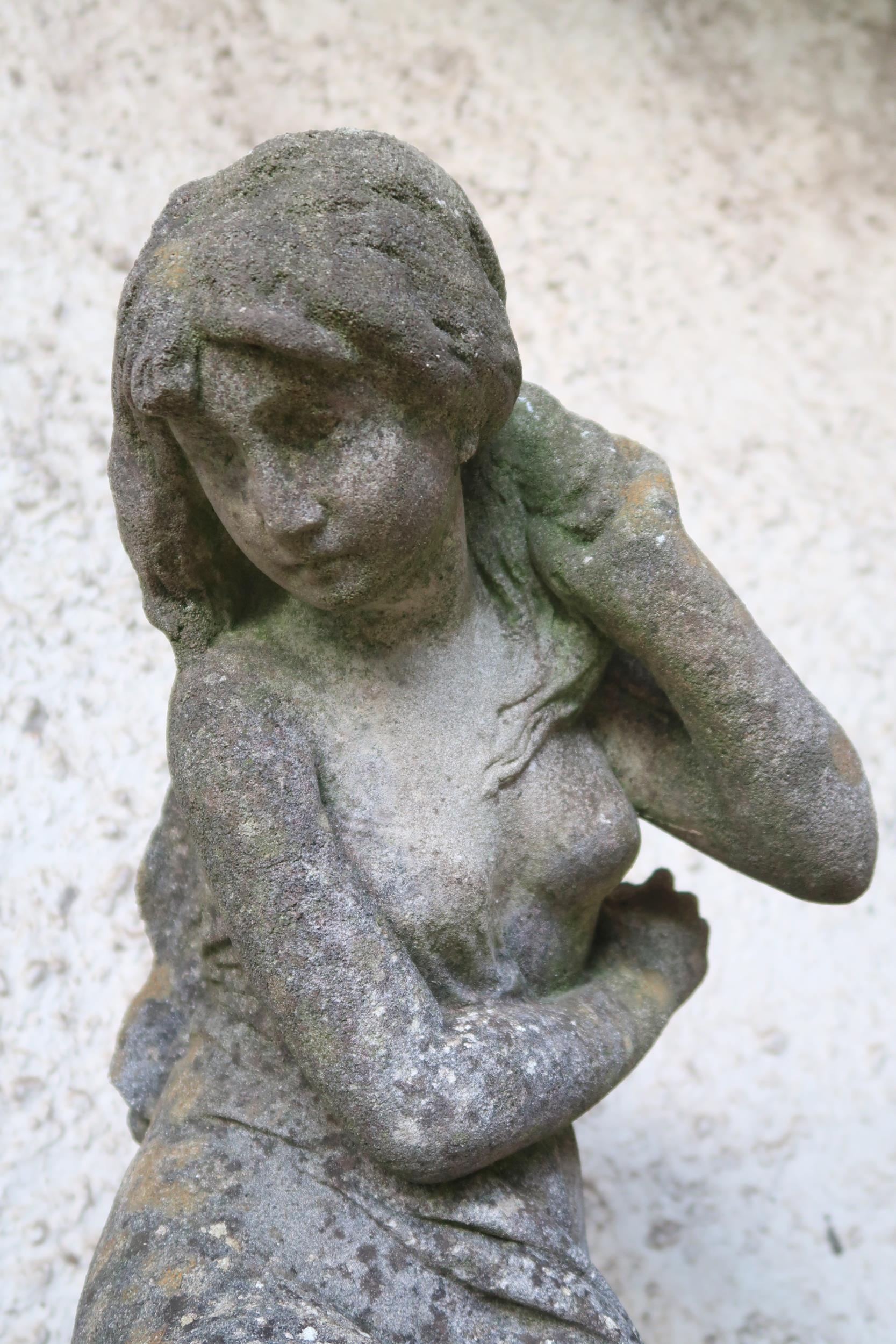 A 20th century reconstituted stone garden statue depicting a nude bather reclining on rocks, 85cm - Image 2 of 3