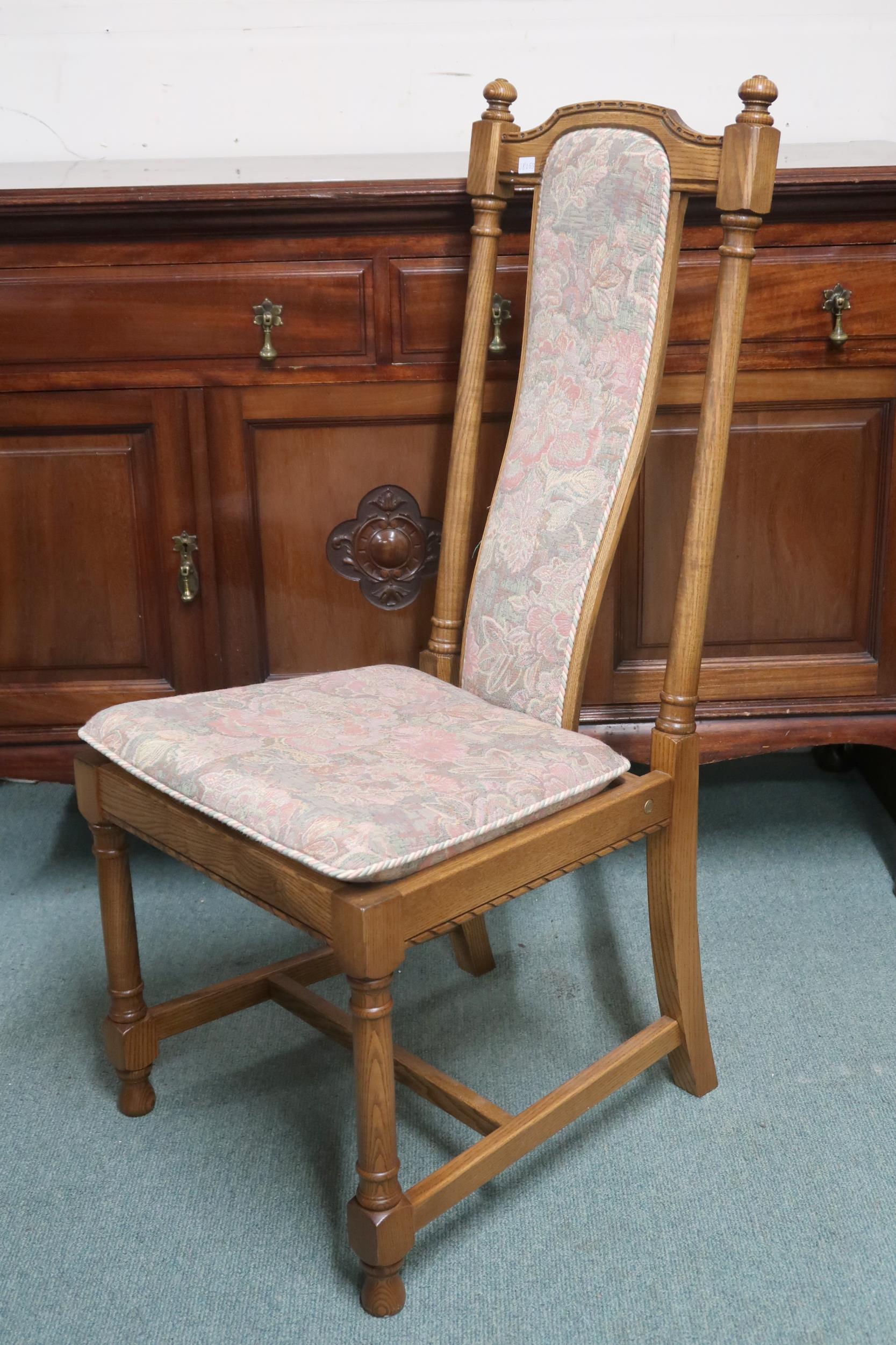 A 20th century Ercol elm and beech extending dining table and six chairs, table on trestle - Image 3 of 3