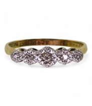 An 18ct gold and platinum five stone illusion set diamond ring, size P1/2, weight 2.8gms Condition