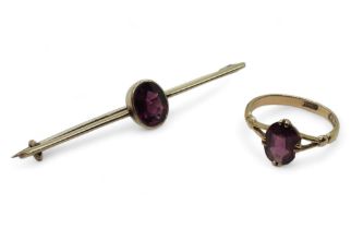 An 18ct gold garnet set ring, size L, together with a similar yellow metal brooch weight together