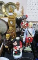 A collection of figural decanters including Black Watch, Abbot's Choice, a Big Ben whisky