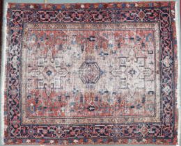 A red ground Caucasian rug with two geometric medallions within multicoloured borders, 176cm long