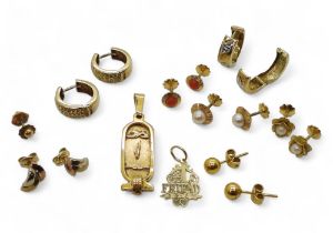 An 18k gold Egyptian hieroglyph pendant, weight 3gms, a 14k Friend pendant weight 0.7gms, and a