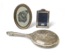 A silver mounted oval photo frame, Birmingham 1923, another by Francis Howard, Sheffield 1992, a