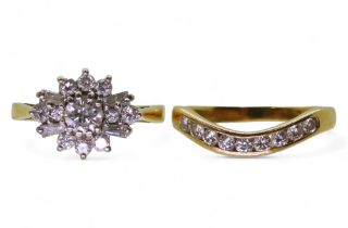 A diamond cluster ring set with estimated approx 0.40cts of brilliant and baguette cut diamonds,