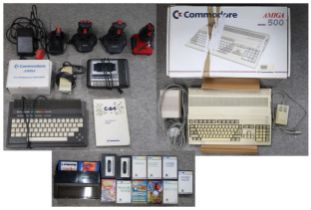 A boxed Commodore Amiga 500 computer and TV Modulator 520, together with a Plus/4 model computer and