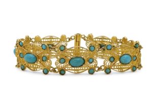 A filigree and turquoise bracelet, made in bright yellow metal stamped with Arabic marks verso and