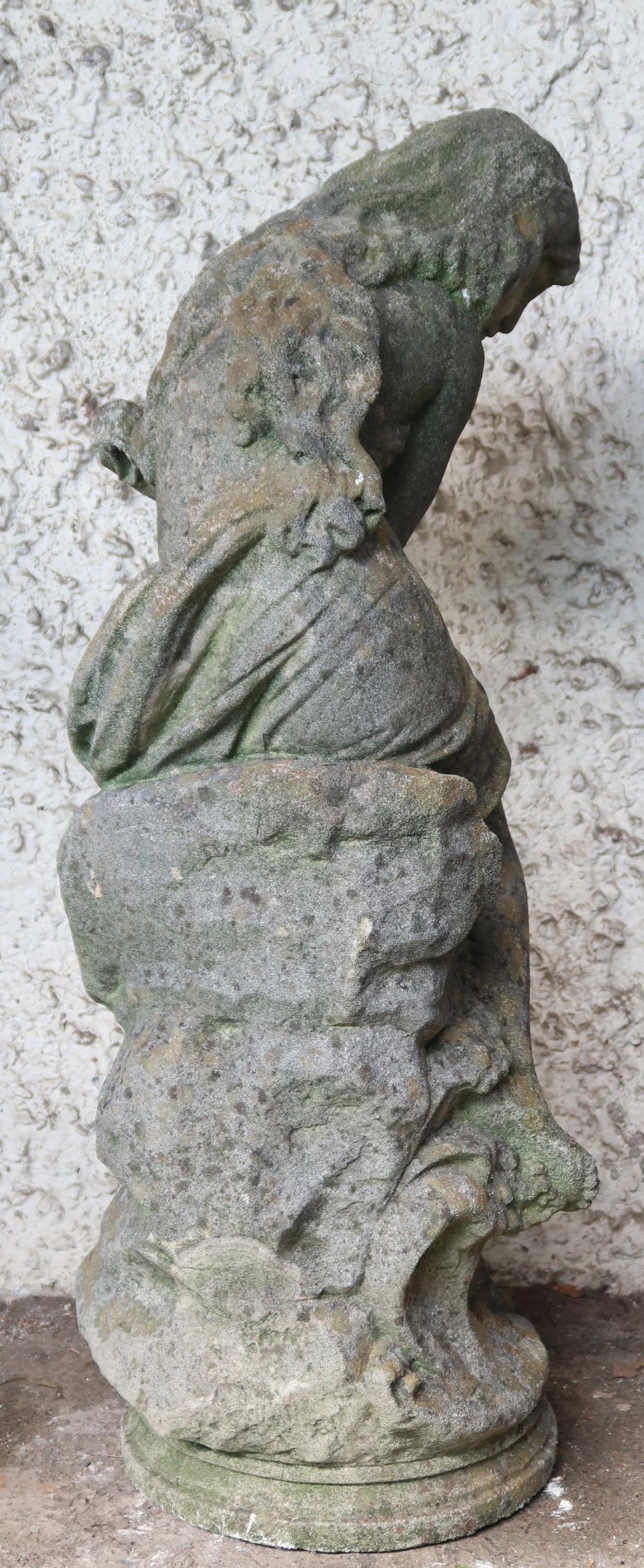 A 20th century reconstituted stone garden statue depicting a nude bather reclining on rocks, 85cm - Image 3 of 3