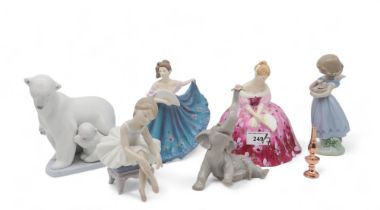 Lladro figures including polar bear and cubs, elephant calf with flower, ballerina, little girl with