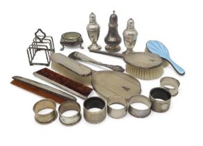 A collection of silver including a four division toast rack by Walker & Hall, Birmingham 1945,