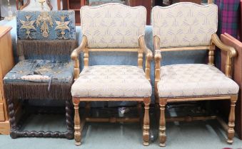A lot comprising a pair of 20th century gilt framed theatre seats with beige geometric upholstery,