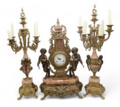 An Imperial of Italy clock garniture, the clock of lyre shape with movement marked  FHS (Franz