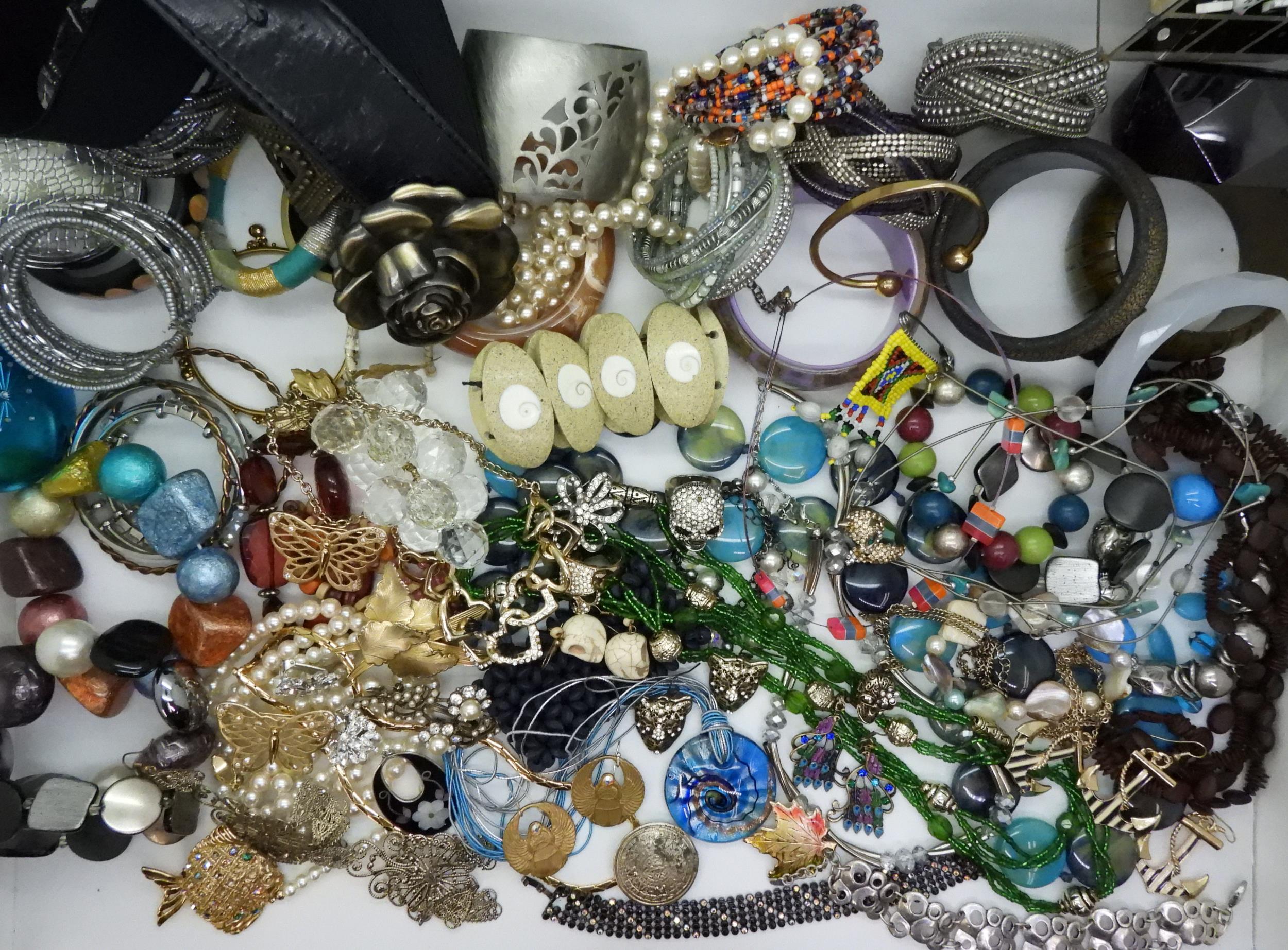 A large collection of costume jewellery to include skull rings, statement bangles and necklaces - Image 2 of 5