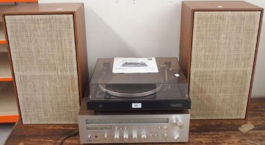 A Dual  CS 505-3 turntable together with an Akai AA-1050 Stereo Receiver and two Made in Denmark 8