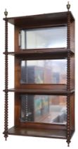 A 19th century walnut four tiered mirror backed wall shelf, rectangular shelves capped with brass