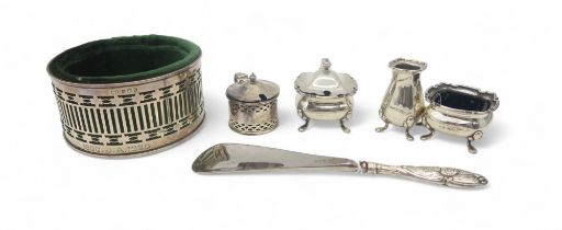 A three piece silver cruet set, by Adie Brothers Ltd, 1950, another mustard pot, a silver bottle