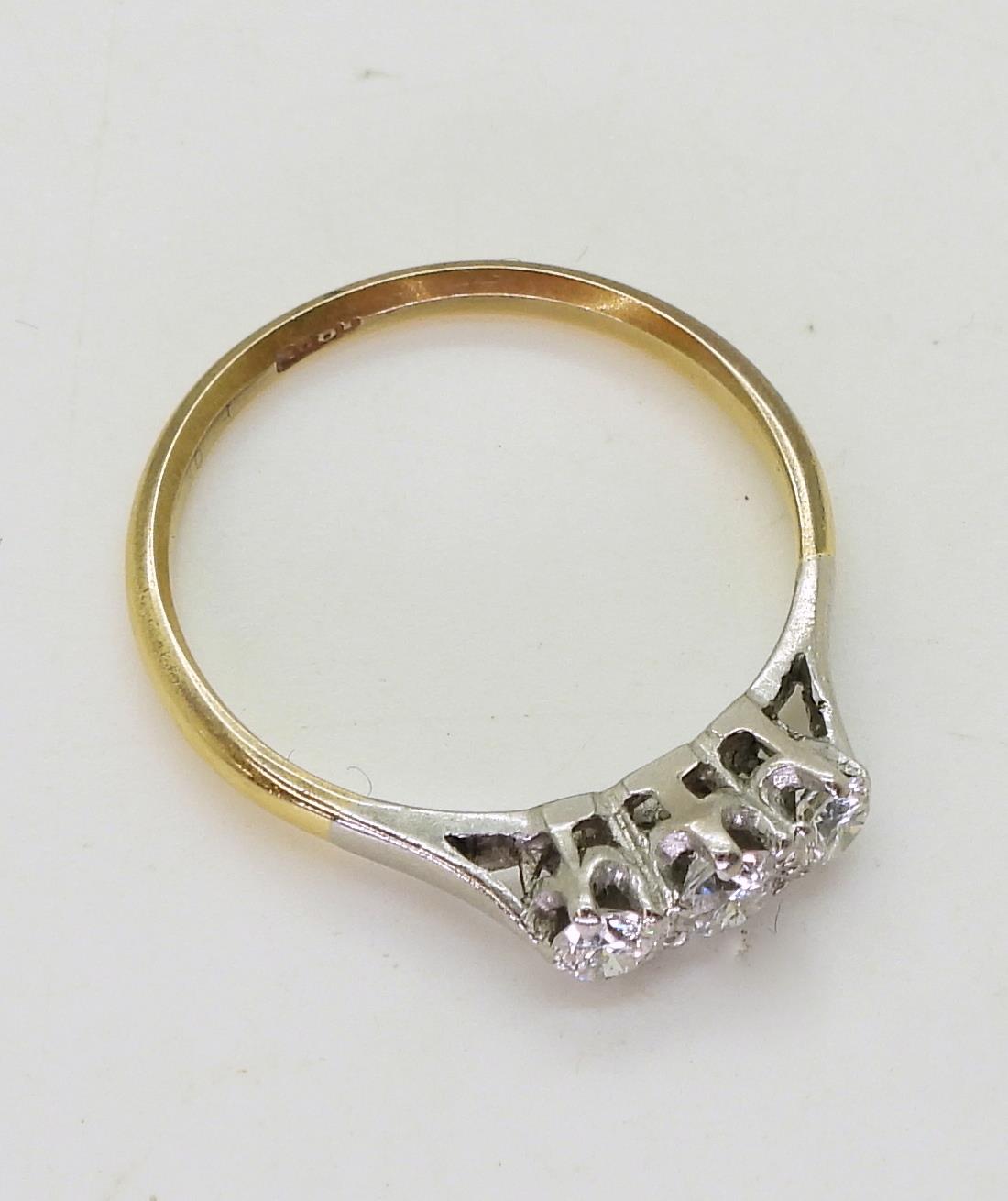 An 18ct gold three stone diamond ring, set with estimated approx 0.25cts in total, size M, weight - Image 2 of 2