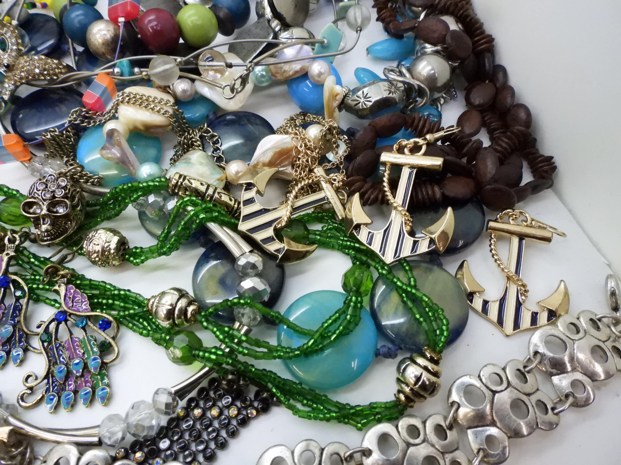 A large collection of costume jewellery to include skull rings, statement bangles and necklaces - Image 5 of 5