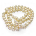 An opera length of baroque pearls each pearl approx 12.3mm x 10mm, overall length 80cm Condition