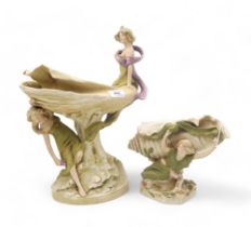 A Royal Dux centrepiece modelled as two maidens with a shell shaped dish, model no 1520, together