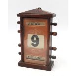 An Edwardian perpetual desk calendar, measuring approx. 22cm in height Condition Report:Available