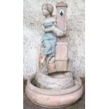 A contemporary reconstituted stone figural garden water feature depicting maiden filling an urn,