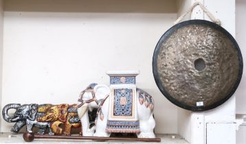 A mixed lot to include a 20th century ceramic elephant form plant stand, brass gong with