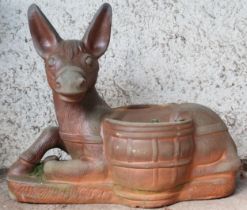 A contemporary decorative stoneware garden planter modelled as a donkey at rest with saddlebags