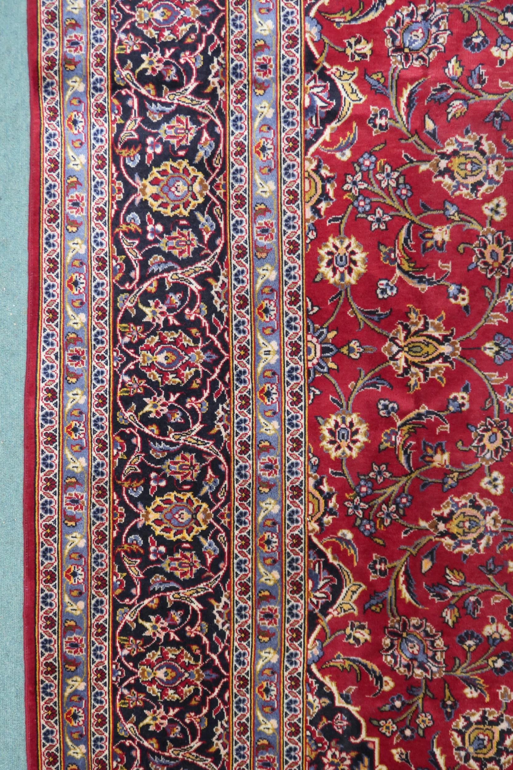 A RED GROUND KASHAN RUG  With dark blue and cream diamond central medallion and matching spandrels - Image 5 of 9