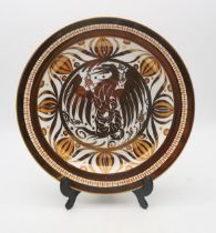 An A.E. Gray & Co Gloria Lustre platter, decorated with a gilt phoenix, painters mark H.M.L and