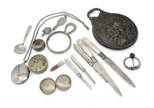 A collection of silver including mother of pearl fruit knives, a silver magnifying glass by Lawrence