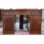 An early 20th century mahogany pedestal desk with central long drawer flanked by short drawers