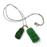Two Chinese green hardstone pendants, with a 40cm 14k gold snake chain, dark green pendant carved