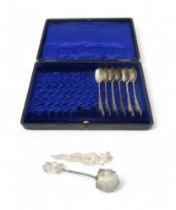 A cased part set of silver tea spoons, Sheffield 1928, a Thai white metal letter opener and spoon,