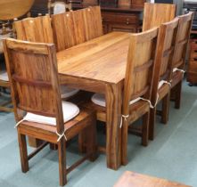 A contemporary mangowood dining table and eight chairs, table with square supports, 76cm high x